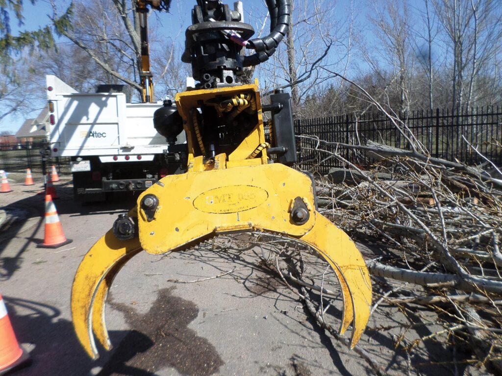 knuckle-boom-mounted grapple