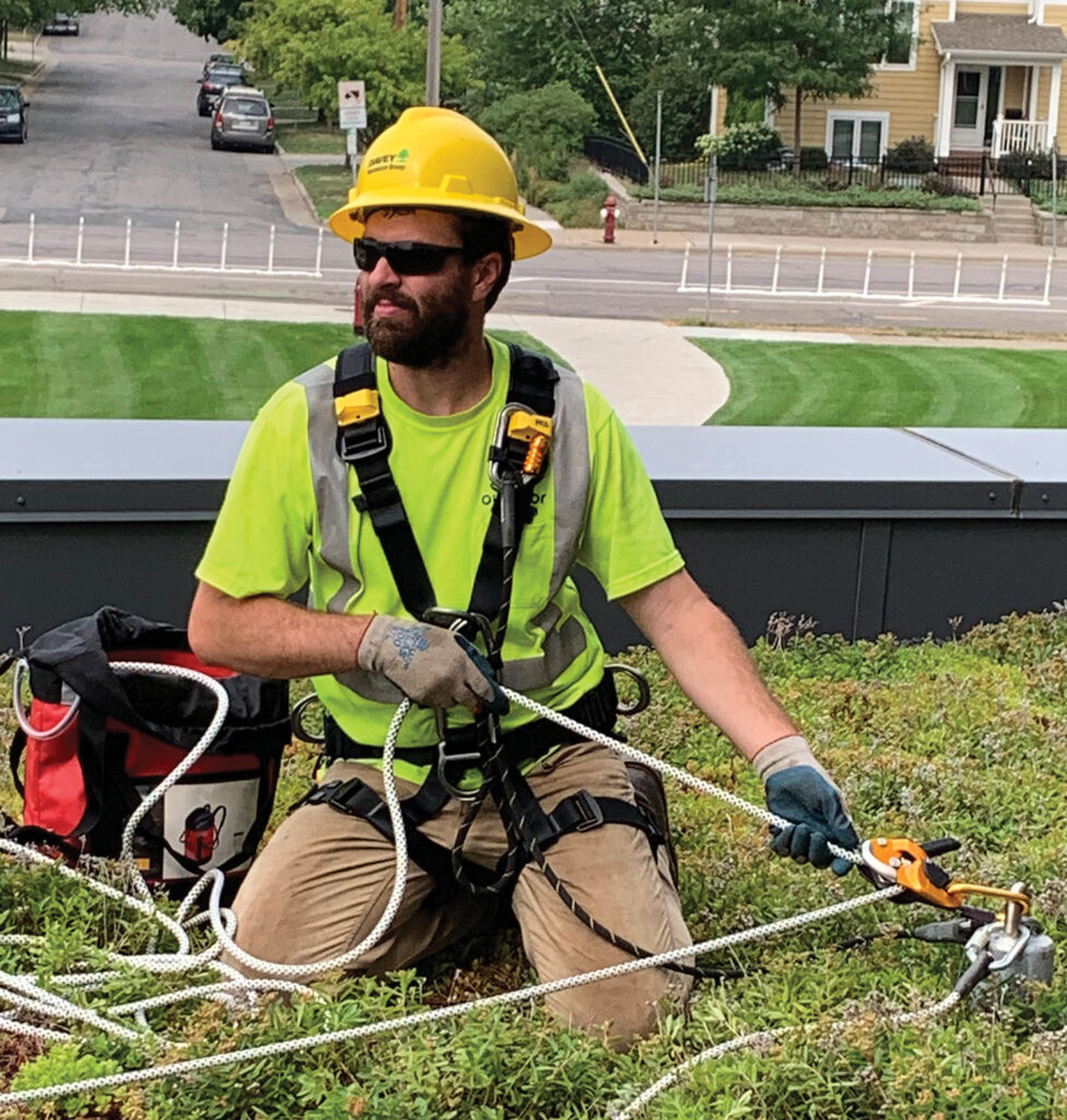 Photo 3: A worker getting ready to tension the horizontal lifeline. Non-traditional job site 